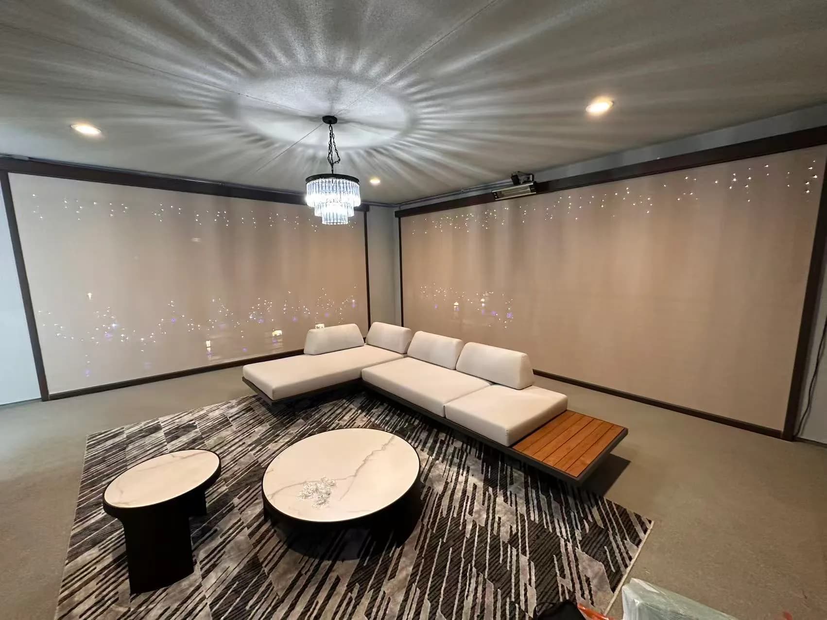 Exterior shades installed around a covered seating area.