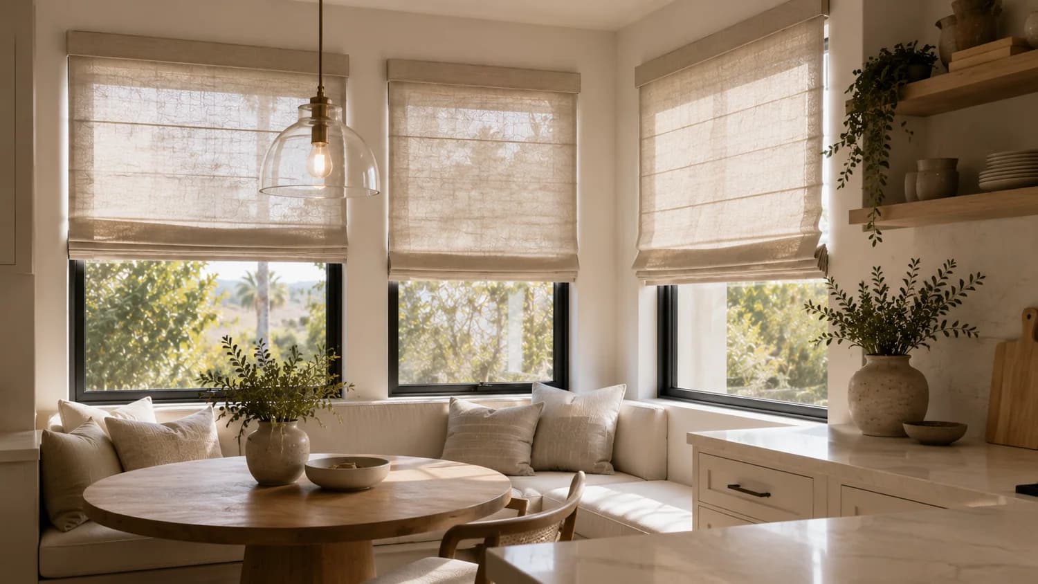 Roman shades installed in a living room with corner windows.