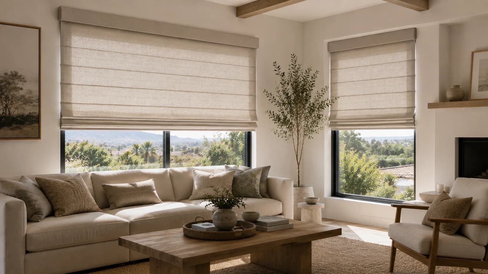 Roman shades installed in a neutral living room.