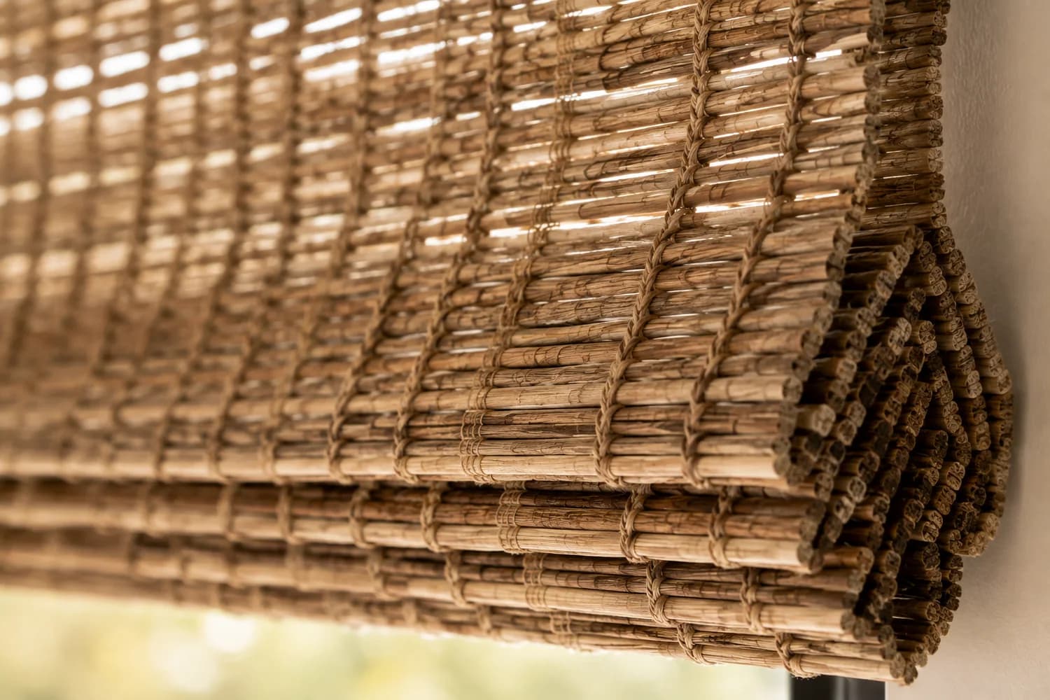 Close-up of woven wood shade material with bamboo-like texture.