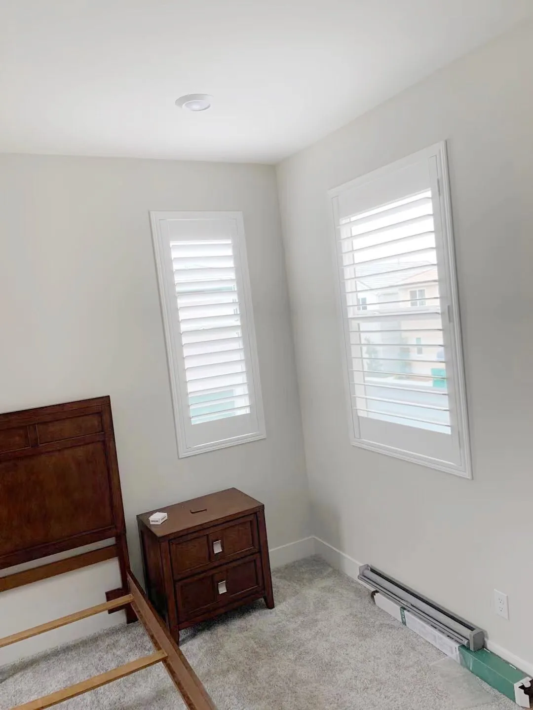 White plantation shutters on two bedroom windows in a Great Park home in Irvine